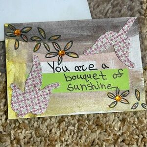 Handmade Card Artwork with Pink Glitter and Orange Rhinestone Floral Accents